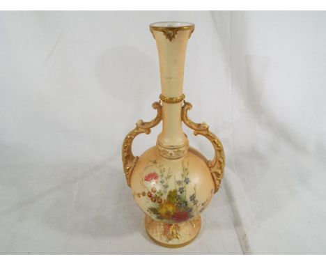 A Royal Worcester twin handled vase decorated in a floral design on a blush ivory ground, 26.5 cm (high)