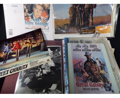 An album containing film movie promotions, press cuttings and other promotional material relating predominantly to Alan Ladd,