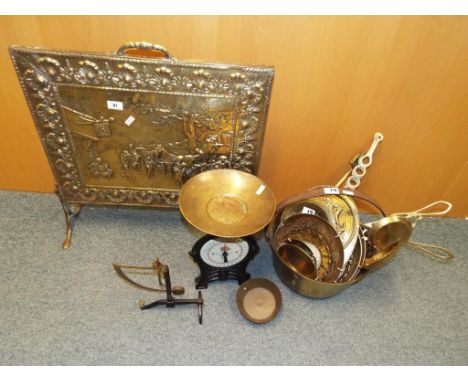 A quantity of good quality ornamental brass ware to include a jam pot, fire screen, brass wall plaques, a set of scales by EK