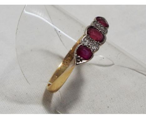 A lady's 18 carat gold ruby and diamond dress ring, approximate weight 1.79 grams all in, size O plus. Estimate £175 - £225