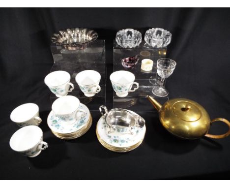 A good mixed lot to include a carved ivory napkin ring (not for export), a brass teapot, glassware and a six place setting te