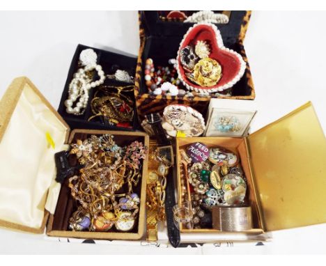 A very large quantity of good quality costume jewellery contained in jewellery boxes to include predominantly vintage broache