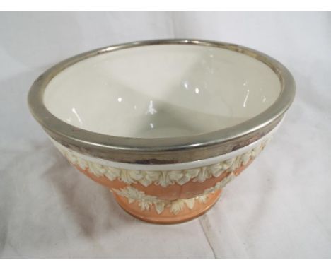 A large Royal Worcester / Locke & Co pedestal bowl with relief foliate decoration, and white metal rim, 15 cm (high) x 25 cm 