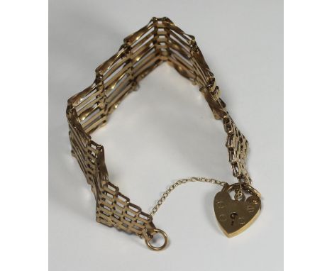 A 9ct gold seven-bar gate bracelet, with heart-shaped padlock and safety chain, 16.56g 