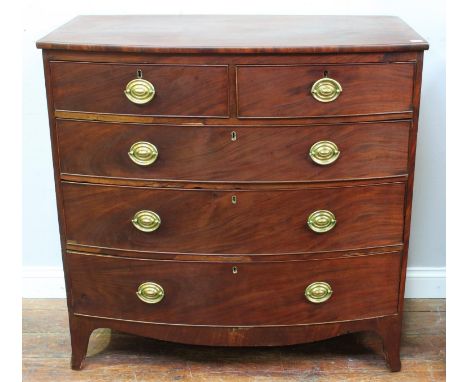 A 19th century bow-front mahogany chest of two short and three long graduated drawers, oval brass handles and escutcheons, sp