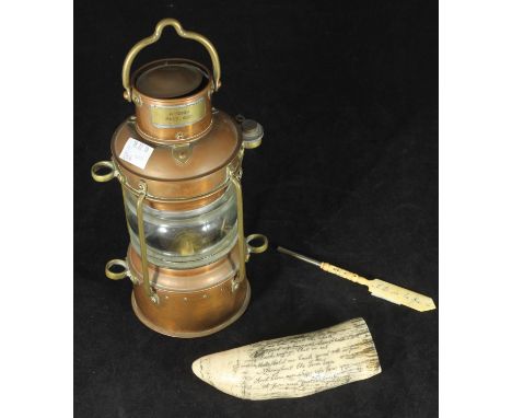 A carved bone Stanhope pen with views of French monuments, finial with applied 'Notre Dame' circular plaque, together with a 