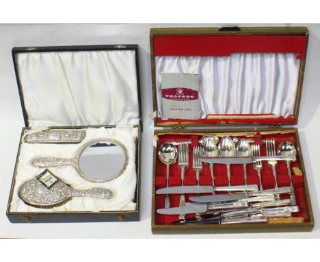 A three-piece silver mirror and brush set (lacking comb), in satin lined box, Birmingham, 1968, maker's mark of WI Broadway &