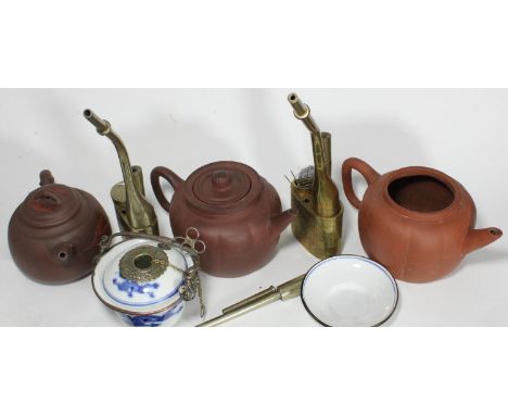 Three assorted Yixing pottery teapots, together with three various opium pipes, one brass, one white metal and one ceramic ex