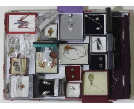 A quantity of silver and amber jewellery including rings, necklaces and earrings, a diamante rabbit pendant and chain, enamel