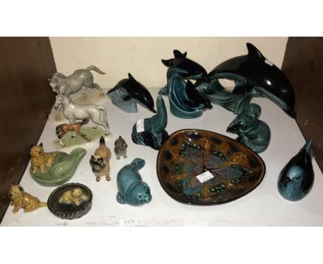 SECTION 7.  A set of three graduated Poole pottery dolphins, together with a Poole pottery seal, otter, pigeon and sea lion, 