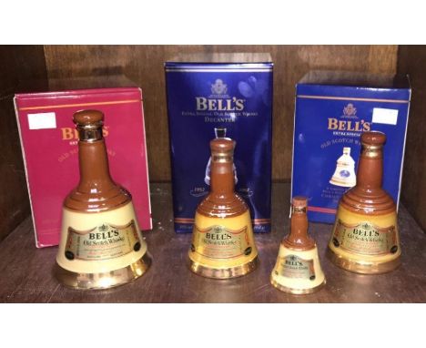 Three full Bell's Extra Special Old Scotch Whisky boxed ceramic decanters: Golden Jubilee 1952-2002, Christmas 2000 and 2001,