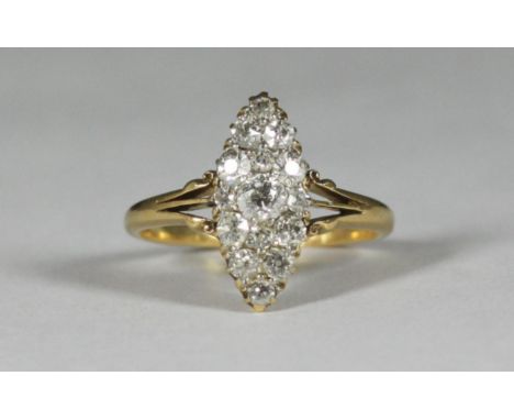 An 18ct gold ring, the top with a marquise cluster comprising 15 diamonds, total estimated diamond weight just over 1ct, gros