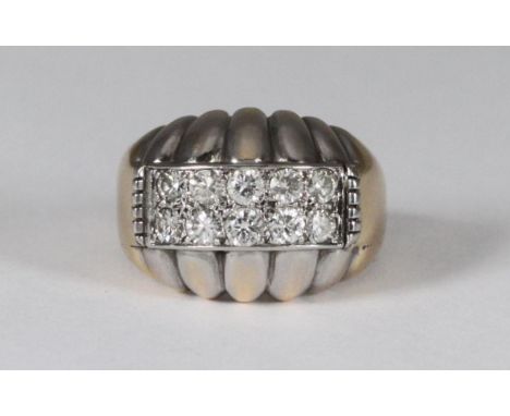 An unmarked bi-colour metal gent's ring set to the top with ten diamonds in two rows, estimated total diamond weight, 1 carat