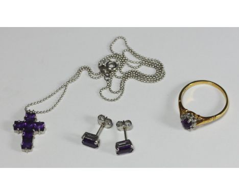 An 18ct yellow gold, amethyst and diamond ring, together with an 18ct white gold and amethyst necklace and crucifix pendant, 