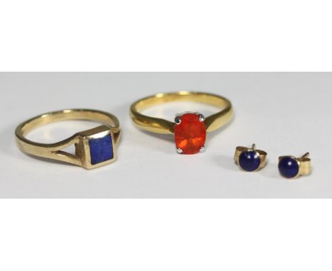 An 18ct gold dress ring claw-set with an oval orange faceted gemstone, 3.4g, together with a 9ct gold and lapis lazuli ring a