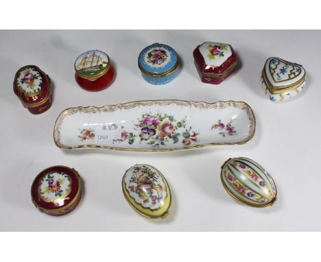 Seven enamelled French porcelain shaped boxes with gilt-metal-mounted hinged covers and polychrome floral decoration, includi
