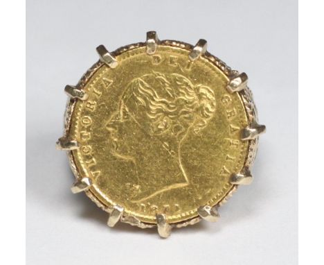 A 9ct gold ring set with a Victorian 1871 half-Sovereign and with pierced and scrolling band, gross weight approx. 9.5g 