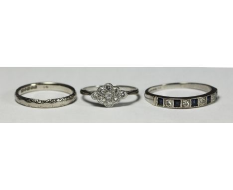 An 18ct diamond and sapphire ring together with an 18ct gold wedding ring, and unmarked white metal and diamond ring (marks r