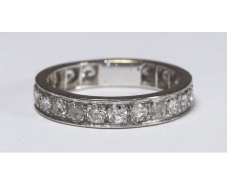 An unmarked Platinum or 18ct white gold diamond eternity ring set with 20x rbc diamonds, estimated total diamond weight 1.80-