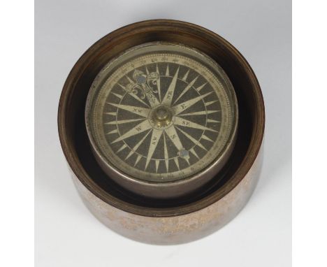 A silver cased compass, the printed paper dial signed Gregory &amp; Wright, London; dial clamp and conical pivot, in turned f