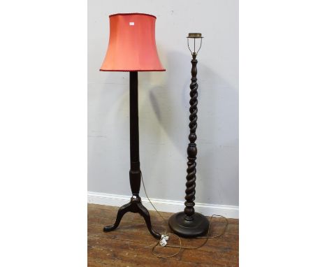 A 19th century stained mahogany standard lamp with fluted and reeded column, leaf-carved tripod base, together with a stained