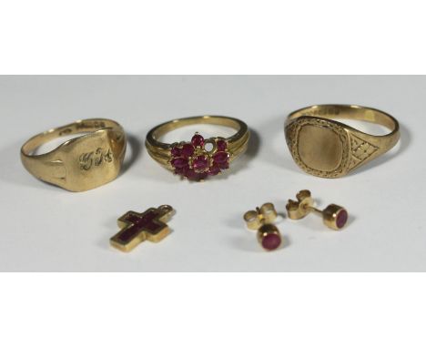 Two 9ct gold signet rings together with a 9ct gold ring set with synthetic rubies, a pair of stud earrings, and crucifix set 