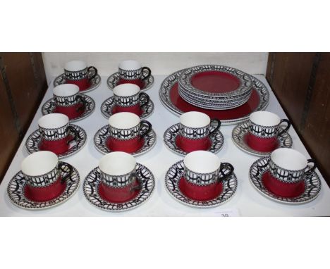 SECTIONS 30 &amp; 31.  An early 20th century Royal Worcester tea and coffee set with black swags to a white upper ground and 