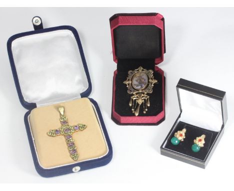 A silver-gilt crucifix set with amethyst and peridot coloured stones, 8cm long, in fitted box, together with a pair of silver