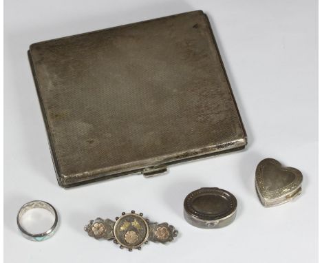 A silver cigarette case with engine-turned decoration, together with two silver pill boxes, brooch and enamelled ring, 182.3g