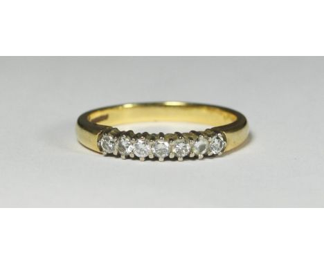 An 18ct gold seven-stone half eternity ring, rbc, estimated 0.49cts, 5.2g 