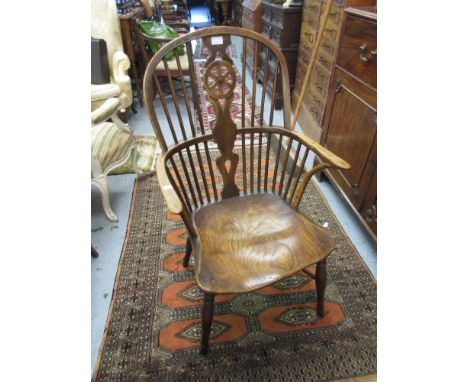 Pair of 19th Century yew wood elm seated wheel and stick back Windsor armchairs with turned supports and crinoline stretchers