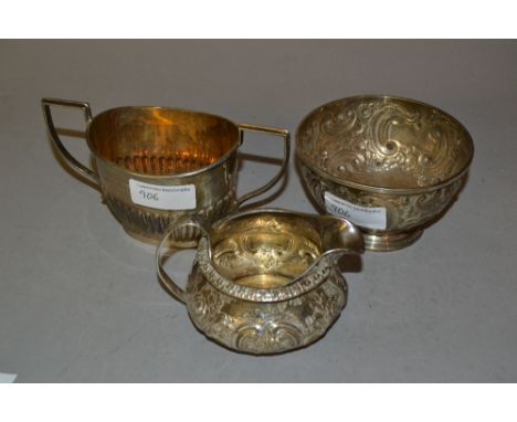 George III small floral embossed silver cream jug, Victorian silver sugar basin and a 20th Century Birmingham silver two hand
