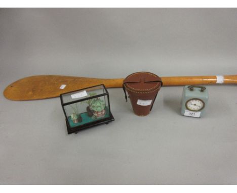Blue enamelled travelling alarm clock, modern stirrup cup in simulated leather case, oriental glazed ornament and a pine cano