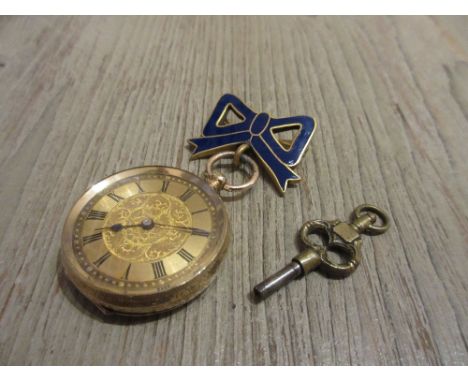 Ladies 14ct yellow gold cased fob watch with enamel bow surmount on gilt metal, including winding key 