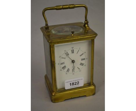 Late 19th or early 20th Century gilt brass cased carriage clock, the enamel dial with Arabic and Roman numerals, the two trai