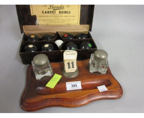 Late Victorian walnut two bottle inkstand together with a set of carpet bowls 