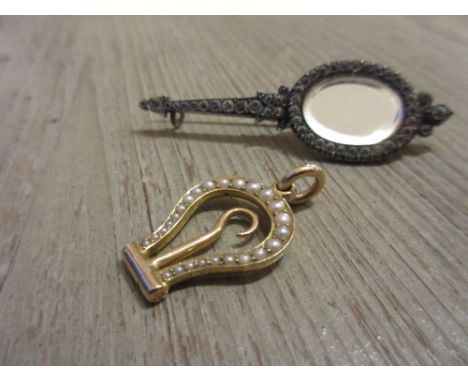 Unusual 19th Century yellow metal pearl set folding glove stretcher / button hook together with a paste set brooch in the for
