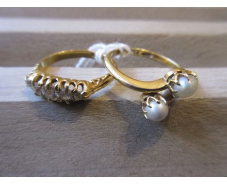 18ct Five stone diamond ring, together with an 18ct gold crossover ring set two button pearls 