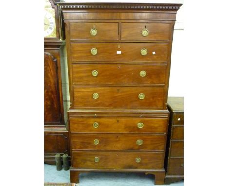 19th Century mahogany chest on chest, the moulded key pattern cornice above three short and three long drawers with brass rin