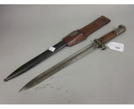 German bayonet with scabbard and leather frog with an 11.5in blade, the scabbard inscribed T.G.F.595 50 and crossed swords 