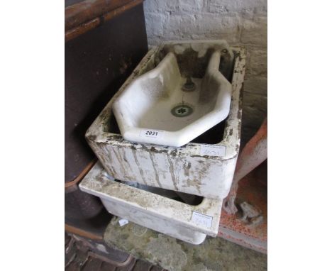 Two small ceramic sinks (at fault), together with a ceramic drinking fountain 