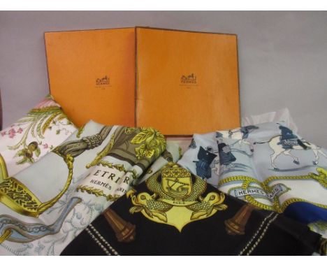 Two ladies Hermes silk head scarves with original boxes and two other ladies Hermes silk head scarvesETRIERS, Paris is 88 x 8