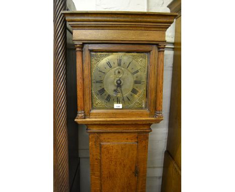 18th Century oak longcase clock with square hood and rectangular panel door, the brass dial with mask head spandrels, Arabic 