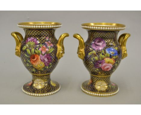 Pair of good quality early 19th Century Spode two handled porcelain small vases painted with flowers within gilded and dark b