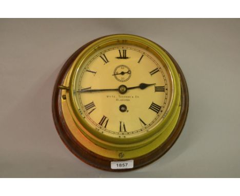 Early 20th Century ships brass bulkhead clock with painted dial, having Roman numerals, subsidiary seconds and single train m