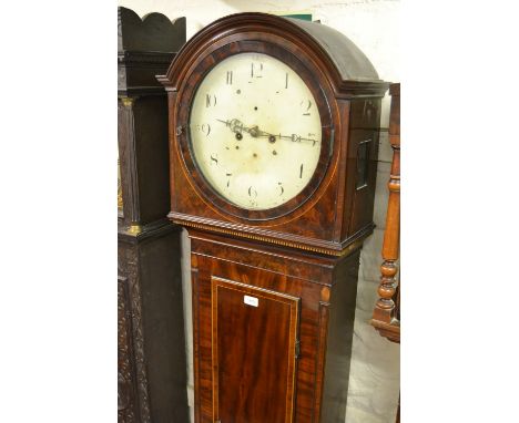 19th Century mahogany and inlaid longcase clock with an arched hood above rectangular panel door, raised on low turned feet, 