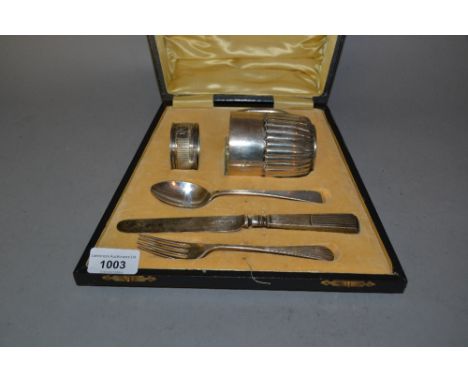 Silver Christening mug, napkin ring, knife, fork and associated spoon in a fitted case 