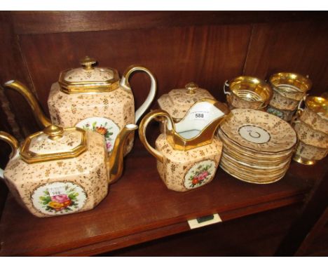 19th Century Paris porcelain tea service painted with panels of floral bouquets on a pale pink and gilt ground (some damages)