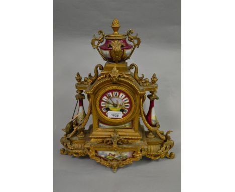 19th Century French gilded spelter and porcelain two train mantel clock, together with an American oak cased two train mantel