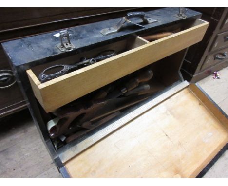 Black tool box containing a quantity of various antique tools including: chisels, moulding planes, spoke shaves etc 